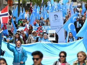 Uyghures marching in Brussels in April 2018 to demand international action to stop China from prosecuting minorities. (AFP)