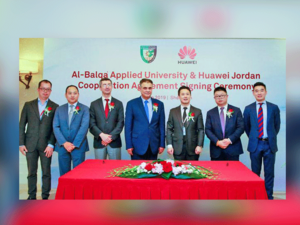 Representatives from Balqaa Applied University and Huawei Jordan pose for a photo during a signing ceremony in Shenzhen, China. (PETRA)