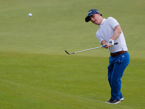 Brendan Lawlor of Ireland chips onto the 18th green during the EDGA Scottish Open