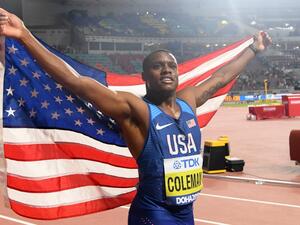 Christian Coleman of the United States celebrates after winning the gold medal in the men's 100 meters final during day two of the 17th IAAF World Athletics Championships in Doha