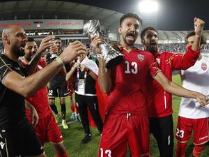 Bahrain's players celebrate after winning the 24th Arabian Gulf Cup Final football match between Bahrain and Saudi Arabia at the Khalifa International Stadium in the Qatari capital Doha on December 8, 2019.