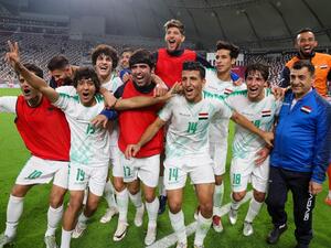 Iraq's players celebrate after the 24th Arabian Gulf Cup Group A football match between Qatar and Iraq at the Khalifa International Stadium in the Qatari capital Doha on November 26, 2019. KARIM JAAFAR / AFP