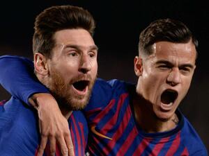 ميسي (يسار) يقود برشلونة للقب الدوري الإسباني