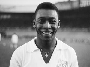 Brazilian striker Pelé, wearing his Santos jersey, smiles before playing a friendly soccer match with his club against the French club of "Racing", on June 13, 1961 (Photo by AFP)