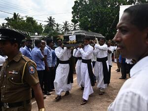 Relatives and priests carry the coffin of a bomb blast victim after a funeral service at St Sebastian's Church in Negombo on April 23, 2019. (AFP)