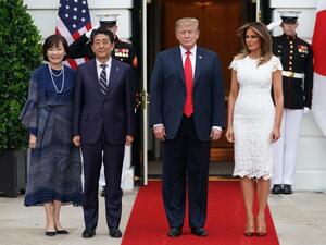 US President Donald Trump and First Lady Melania Trump greet Japan's Prime Minister Shinzo Abe and his wife Akie Abe at the South Portico of the White House as they arrive for dinner in Washington, DC on April 26, 2019. (MANDEL NGAN / AFP)