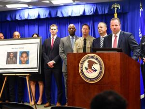 FBI Special Agent in Charge Ryan Young briefs the media beside photos of a suspect arrested in connection with an alleged terror plot targetting Southern California sites on April 29, 2019 in Los Angeles