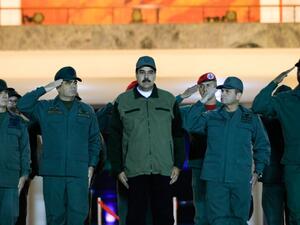 This handout picture released by Miraflores Palace press office shows Venezuela's President Nicolas Maduro (C) receiving the military salute from loyal troops at the "Fuerte Tiuna" in Caracas, Venezuela on May 2, 2019. (AFP)