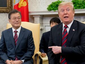 US President Donald Trump and South Korean President Moon Jae-in speak during a meeting in the Oval Office of the White House. (Saul Loeb / AFP)