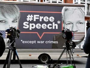 A billboard outside the Ecuadorean embassy showing WikiLeaks co-founder Julian Assange. (AFP/ File Photo)