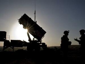 US Air Force shows US soldiers with the 3rd Battalion, 2nd Air Defense Artillery Regiment talking after a routine inspection of a Patriot missile battery. (AFP)