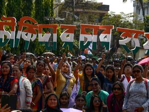 Indian supporters of the Trinamool Congress (TMC) party hold letters forming the slogan of the National Congress, 'Chowkidar Chor Hain' (The watchman is a thief). (AFP)