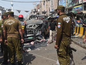 Pakistani security officials examine the site of a bomb blast outside a Sufi shrine in Lahore on May 8, 2019. (AFP/ File)