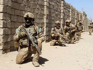 Afghan National Army commandos take position during a military operation in Helmand province. (NOOR MOHAMMAD/AFP/GETTY IMAGES)