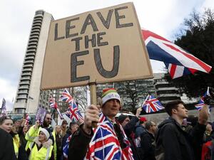 Protesters hold up placards and Union flags as they attend a pro-Brexit demonstration promoted by UKIP in central London. (AFP/ File)