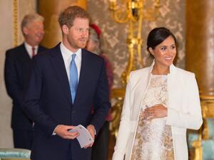 UK's Meghan, Duchess of Sussex (R) and Prince Harry. (AFP)
