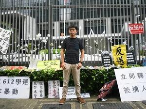 Hong Kong democracy activist Joshua Wong poses during an interview with AFP outside the government headquarters. (AFP/Anthony Wallace)