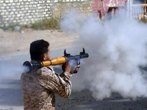 A Libyan fighter loyal to the Government of National Accord (GNA) fires a rocket propelled grenade during clashes with forces loyal to strongman Khalifa Haftar south of the capital Tripoli's suburb of Ain Zara, on April 20, 2019. (AFP)
