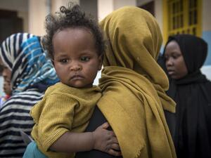 Sudanese refugees, who fled from the clashes between forces loyal to the internationally recognised Government of National Accord (GNA) and forces loyal to strongman Khalifa Haftar, rest at a school in Libya's capital Tripoli on April 24, 2019.  FADEL SENNA / AFP