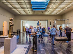 The Louvre. Visitors looking at exhibits in the 2nd Gallery of the Louvre, dedicated to The First Great Powers. (Shutterstock/ File Photo)