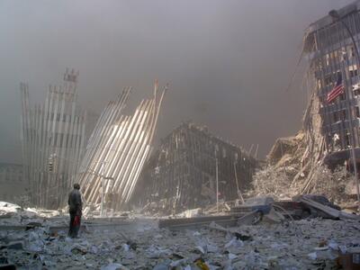 A man stands among the rubble after the collapse of the first World Trade Centre Tower in New York City on September 11, 2001. Photo: AFP
