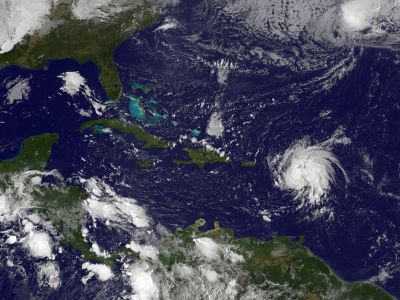 This October 13, 2014 NASA GOES Project satellite photo shows Tropical Storm Gonzalo(Lower-R) near the Leeward Islands in the western Atlantic Ocean. Tropical Storm Gonzalo gained strength Monday, prompting hurricane watch advisories for Puerto Rico and the Virgin Islands, forecasters said. The storm was expected to become a hurricane by nighttime or Tuesday, the National Hurricane Center in Miami said in its latest bulletin. AFP 6.5-magnitude earthquake rattles Leeward Islands