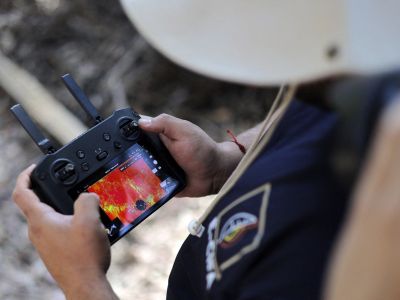 Firefighter using multispectral drones to check for wildfires