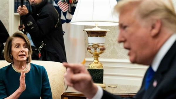 Then-House Minority Leader Nancy Pelosi (L) and US President Donald Trump argue while making statements to the press before a meeting at the White House in Washington, DC, on December 11, 2018. (AFP)