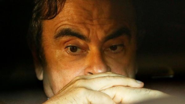  Former Nissan Motor Chairman Carlos Ghosn sits inside a car as he leaves his lawyer's office after being released on bail from Tokyo Detention House, in Tokyo, Japan on March 6, 2019. He was subsequently detained again.