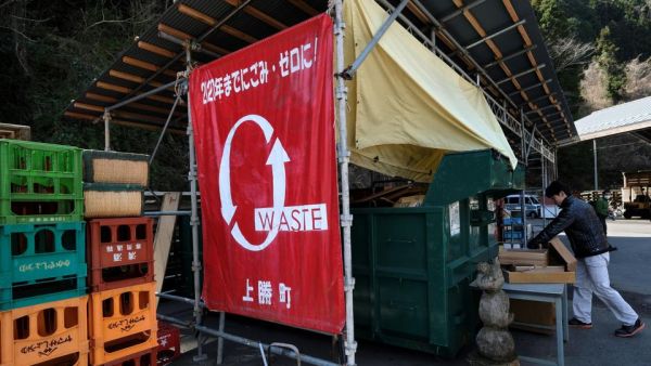  This picture taken on March 14, 2019 shows a banner with a slogan that reads "zero-waste town by 2020" at a waste centre in the town of Kamikatsu, Tokushima prefecture.