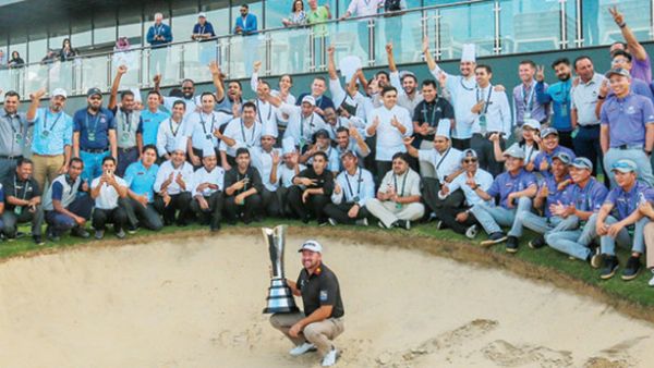 Graeme McDowell celebrates victory, with volunteers in the background. (Supplied)
