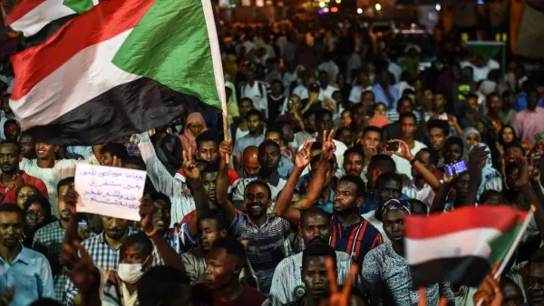 Sudanese protesters wave flags and flash victory signs as they gather for a sit-in outside the military headquarters in Khartoum on May 19, 2019. (AFP/ File Photo)