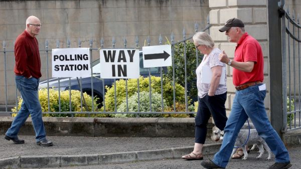 People leave and arrive at a polling station for the European Parliament elections at Bannside Presbyterian Church in Banbridge Co Down, northern Ireland, on May 23, 2019. (AFP)
