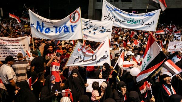 Iraqi followers of Shiite Muslim cleric Moqtada al-Sadr demonstrate in the capital Baghdad's central Tahrir Square late on May 24, 2019, against the involvement in any conflict between Iran and the United States. (AHMAD AL-RUBAYE / AFP)