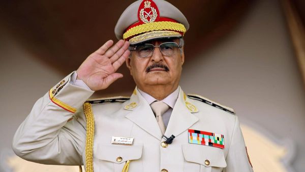 Libyan military commander Khalifa Haftar salutes during a military parade in Benghazi in May 2018. (AFP)