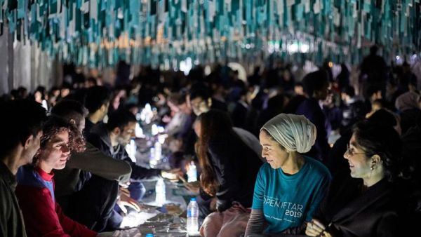 Muslims and non-Muslims gather for an Open Iftar to break their fast during Ramadan. (Ramadan Tent Project)