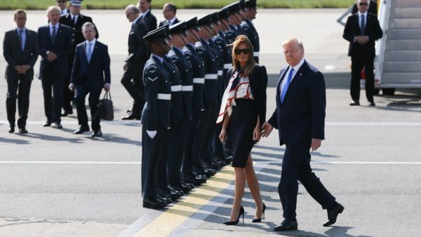 US President Donald Trump (R) and US First Lady Melania Trump (L) walk to the Marine One helicopter after disembarking Air Force One at Stansted Airport, north of London on June 3, 2019. (AFP/ File Photo)