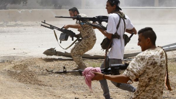 Fighters loyal to the internationally-recognised Government of National Accord (GNA) open fire from their position in the al-Sawani area south of the Libyan capital Tripoli during clashes with forces loyal to strongman Khalifa Haftar, on June 13, 2019. (Mahmud TURKIA / AFP)