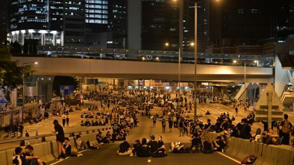 Protesters rest on a road as they rally against a controversial extradition bill in Hong Kong early on June 17, 2019. (AFP/ File Photo)