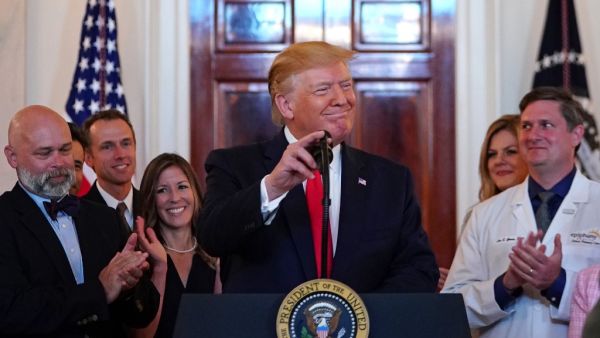 US President Donald Trump speaks before signing an executive order on "improving price and quality transparency in healthcare" in the Grand Foyer of the White House on June 24, 2019. (MANDEL NGAN / AFP)