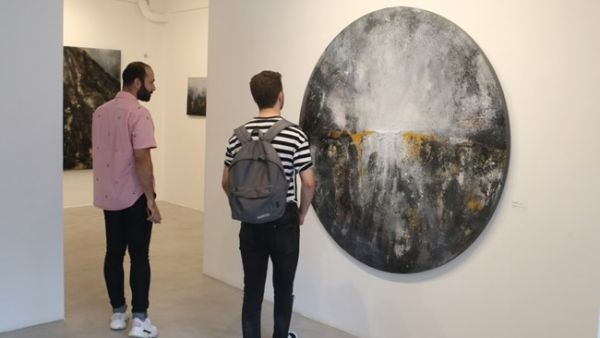 An installation view of "The Road," 2019, tire powder, shredded tires, gypsum and acrylic on canvas. (Photo The Daily Star / Azakir)
