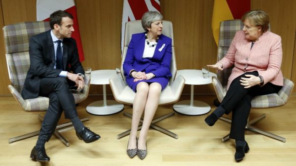 UK PM Theresa May, German Chancellor Angela Merkel and France's Emmanuel Macron at a press conference in Brussels on 22 March 2018. (AFP/ File Photo)