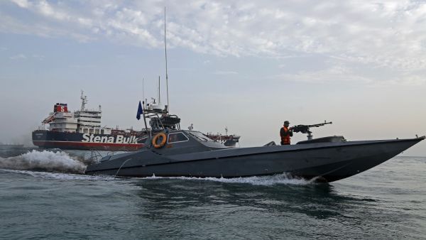 Iranian Revolutionary Guards patrolling around the British-flagged tanker Stena Impero as it's anchored off the Iranian port city of Bandar Abbas  (AFP)