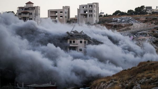Demolition of a Palestinian building which was under construction, in the the Palestinian village of Sur Baher in East Jerusalem (AFP)
