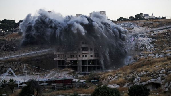 This picture taken on July 22, 2019, shows the demolition of a Palestinian building which was under construction, in the the Palestinian village of Sur Baher in East Jerusalem. (AFP/ File Photo)