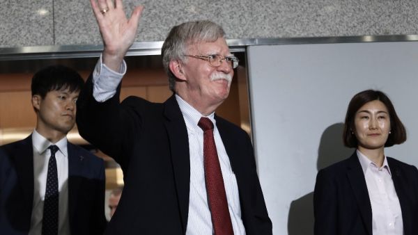 US National Security Advisor John Bolton (C) waves as he leaves after a meeting with South Korea's foreign minister at the Foreign Ministry in Seoul on July 24, 2019.  Ahn Young-joon / POOL / AFP