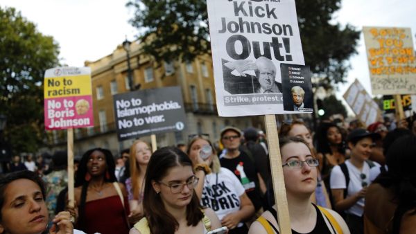 Demonstrators carry placards as they protest against Britain's newly appointed prime minister Boris Johnson outside Downing Street in London on July 24, 2019. (AFP/ File Photo)