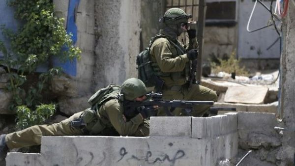 Israeli security forces hold a position during clashes between demonstrators and Israeli security forces at the Qalandiya checkpoint, between Ramallah and Jerusalem(AFP/ File Photo)