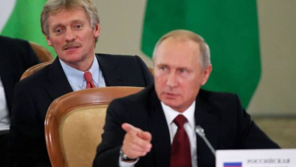 Russia's President Vladimir Putin (front) and Kremlin spokesman Dmitry Peskov attend a session of the Council of Heads of the Commonwealth of Independent States (CIS) in Sochi. (AFP/ File Photo)