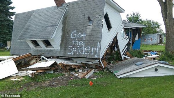 The words, 'Got the Spider!' were painted on the home's roof. (Facebook)